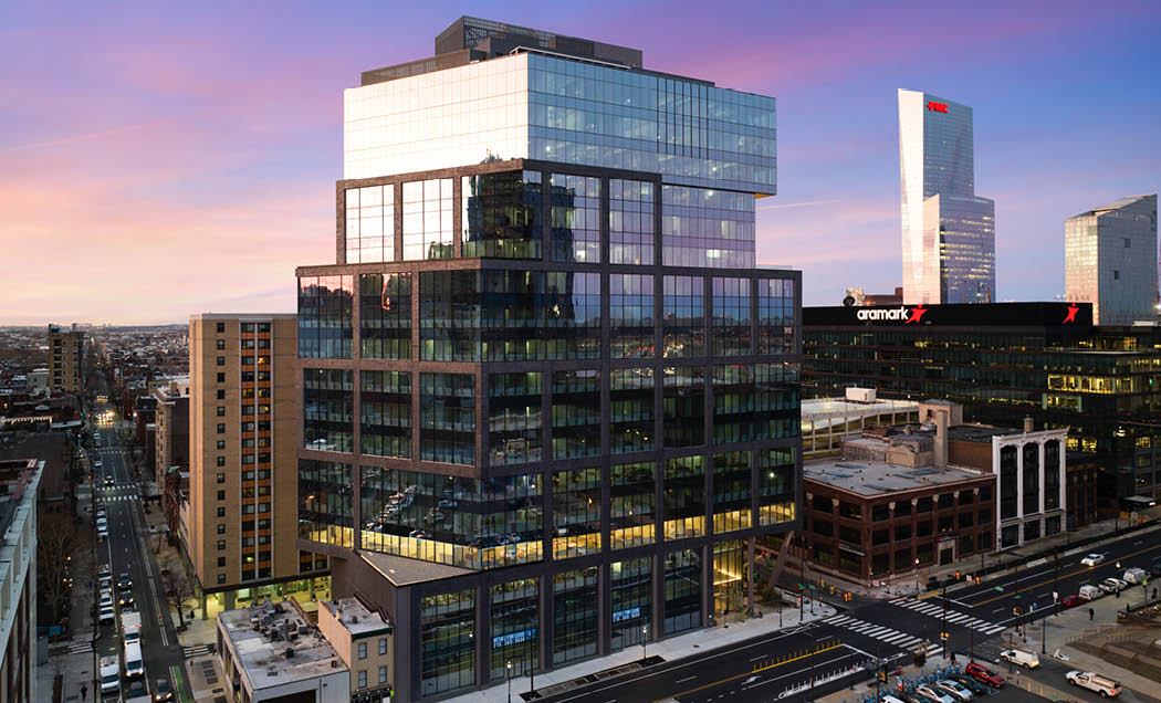 A drone shot of 2222 Market Street with the city of Philadelphia in the background