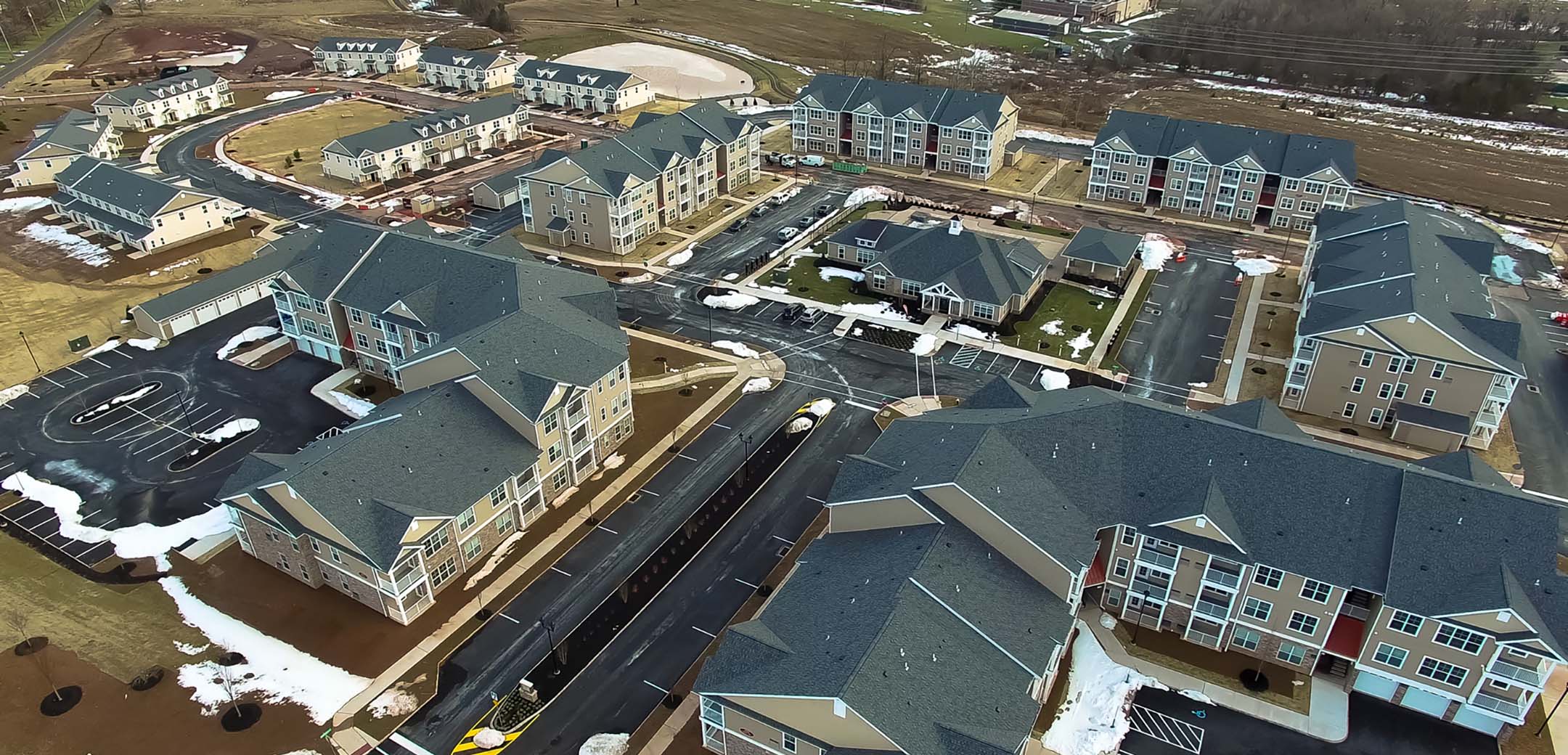 An aerial shot of the Cherry Ridge building, showcasing the large layout, parking amendments, and general area.