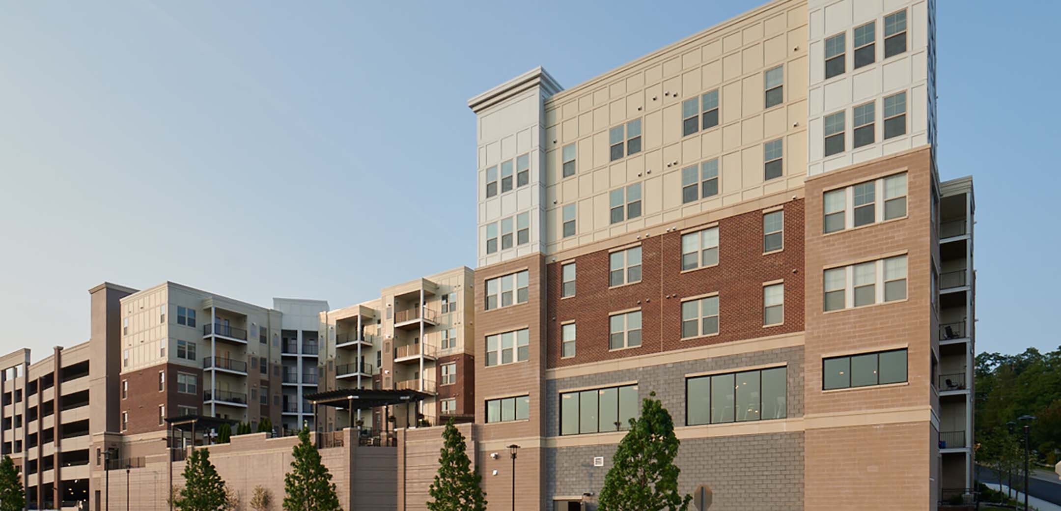 The back view of the Granite Run Apartments showcasing the back street and raised inner courtyard.