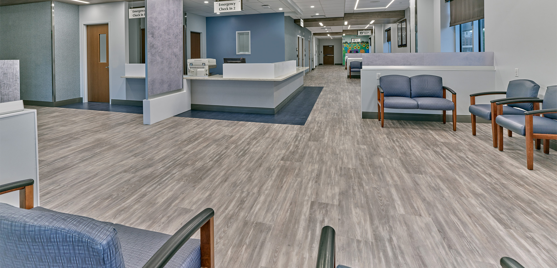 The exterior of St. Luke's Anderson Campus featuring the lobby with gray flooring and blue chairs