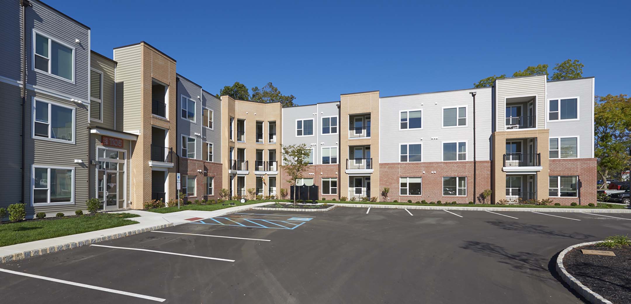 The exterior of the 400 Westside building corner , front entrance and parking lot.