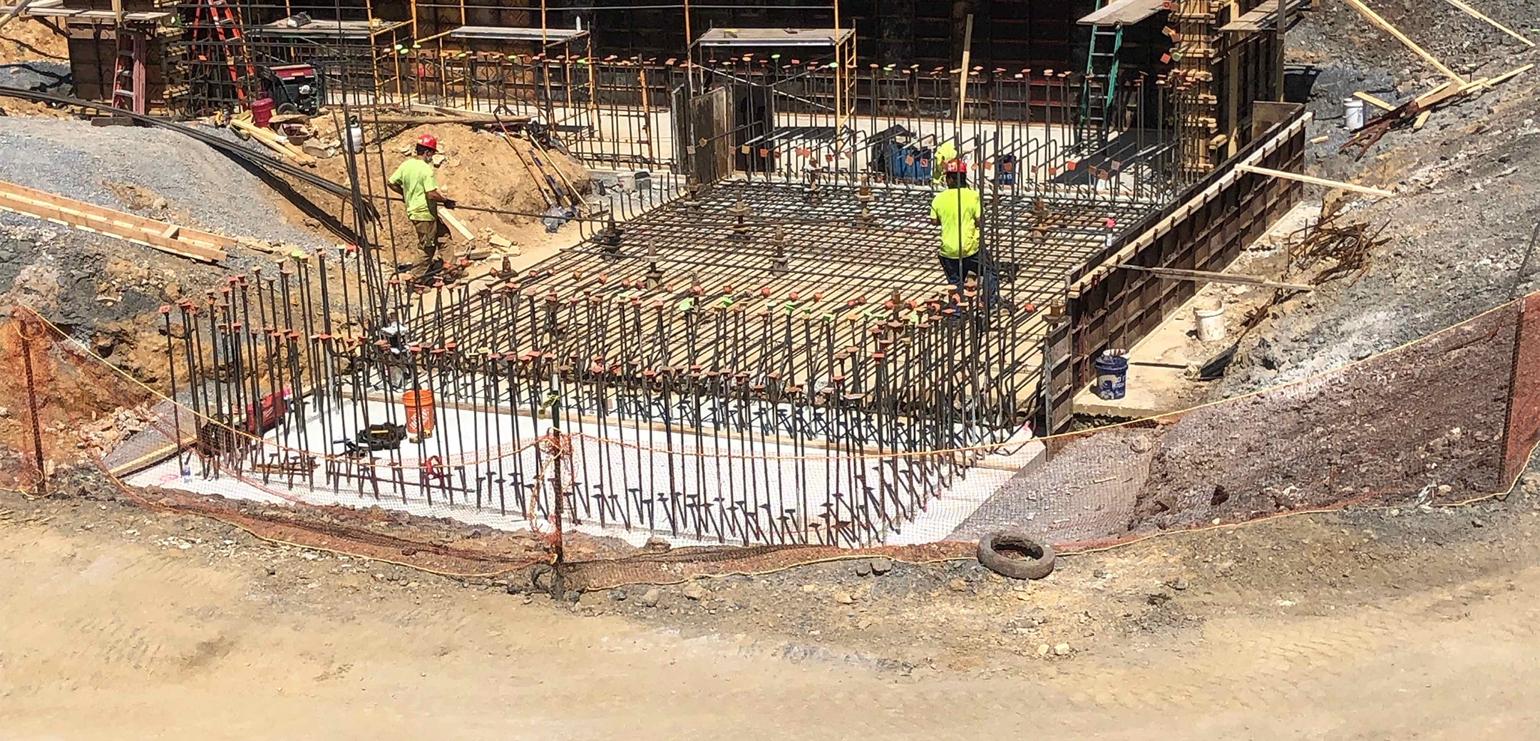 The foundation and metal frame of the carpenter technology recirculating water plant during the construction process.