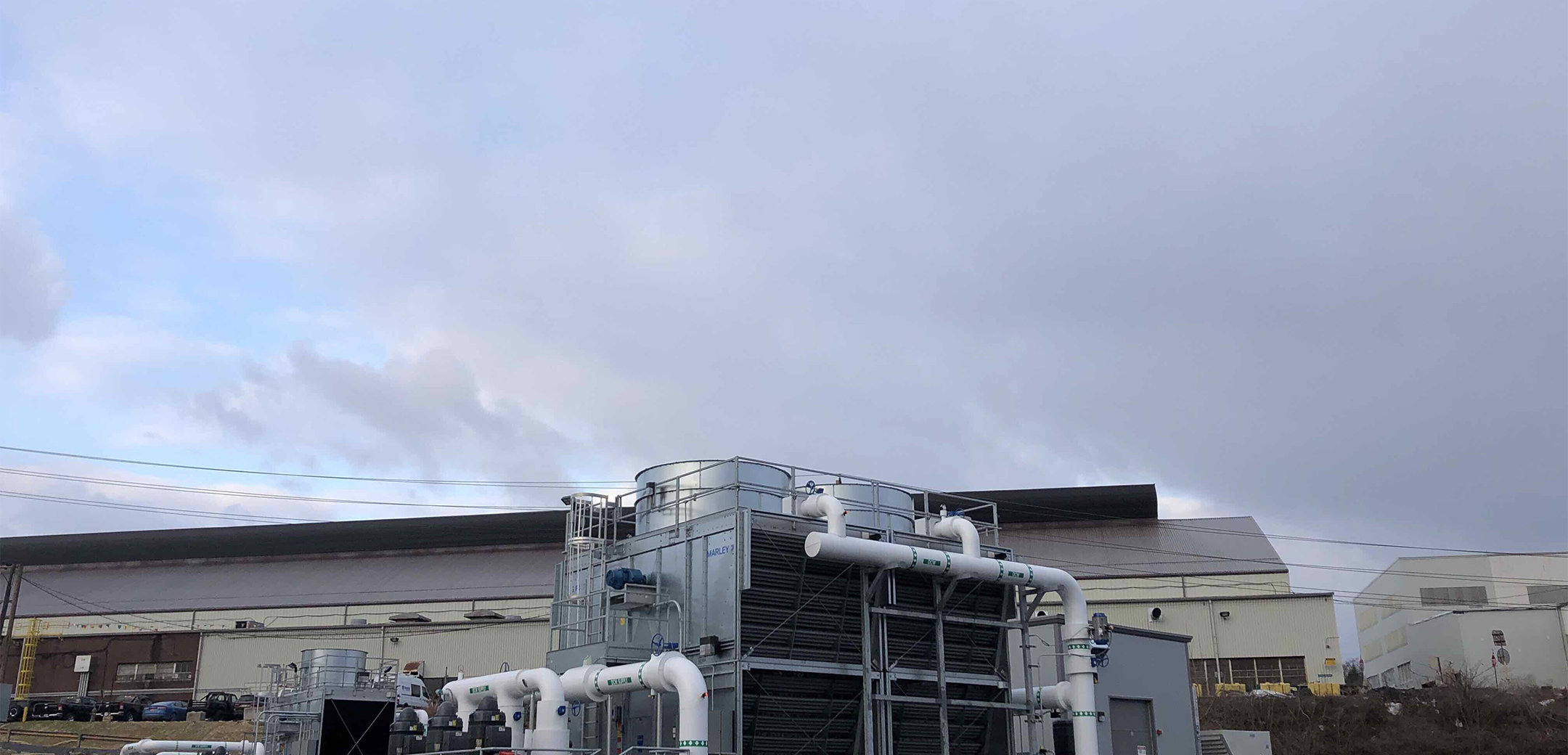 An angled view of the carpenter technology recirculating water plant showcasing the piping and layout of the construction.