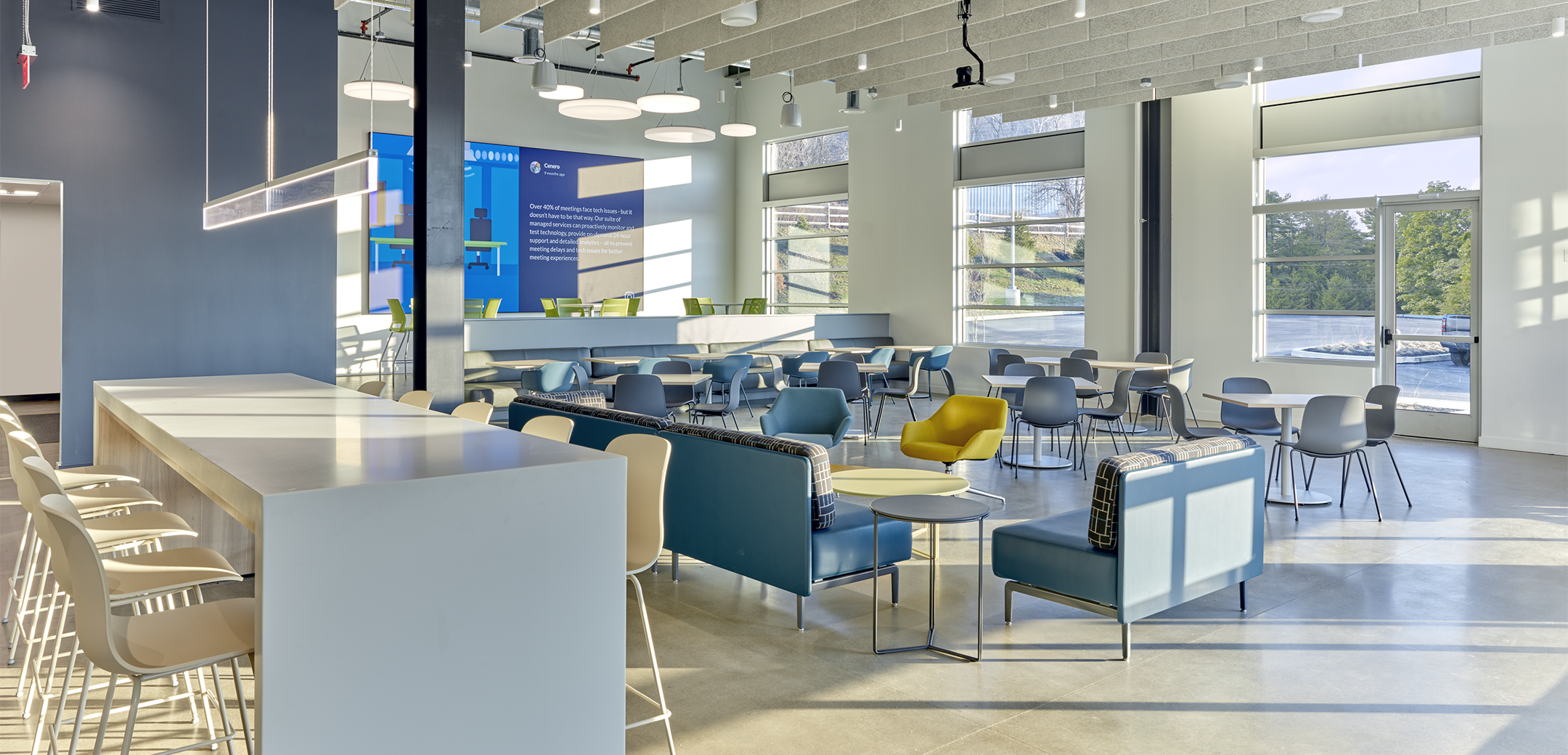The interior of Cenero Headquarters with tables and chairs.